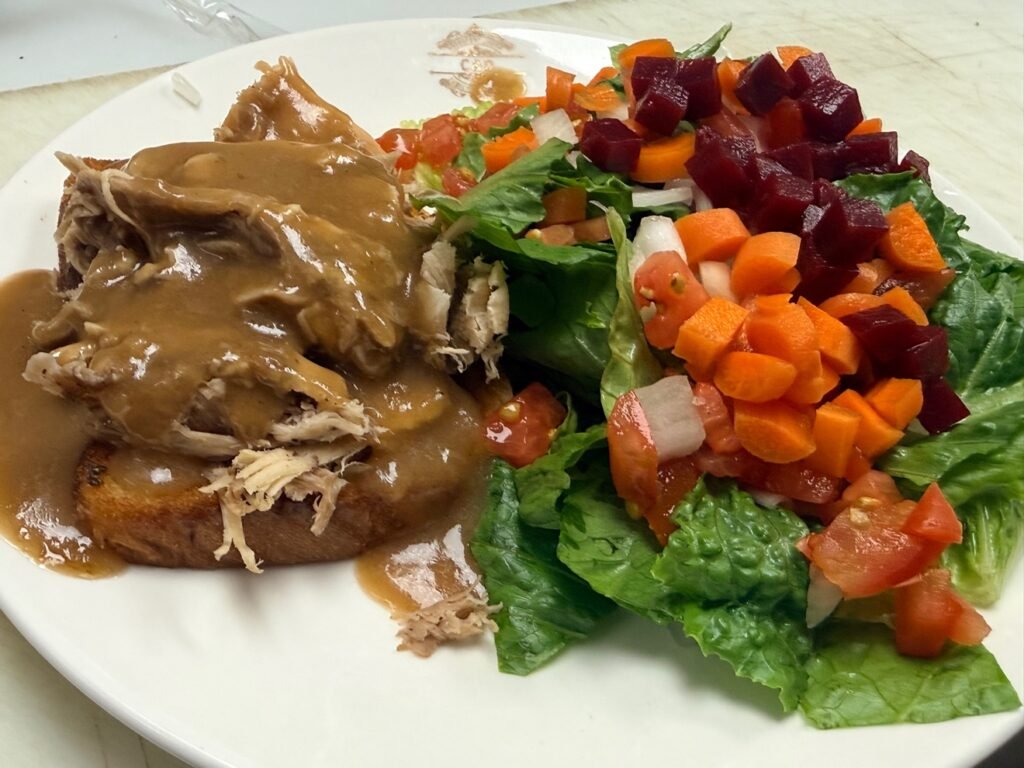 Hot turkey sandwich with gravy and side salad at Cravings and Delight, a family restaurant near Rutherford Edmonton