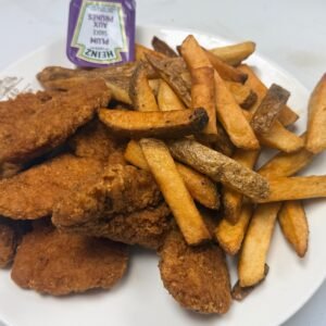 Chicken fingers with fries and plum sauce at Cravings and Delight