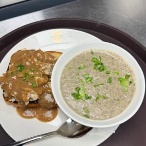 Hot turkey sandwich with gravy and a bowl of cream of mushroom soup at Cravings and Delight